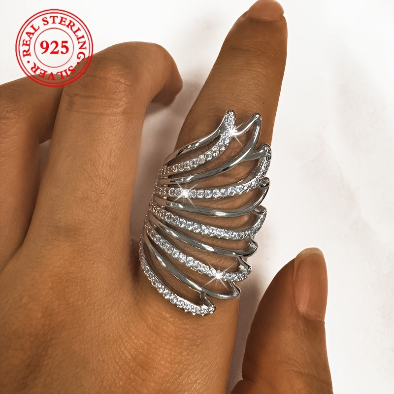 This elegant ring for women exudes a touch of luxury, featuring intricate angel wings with sparkling synthetic zirconia. Made of lightweight silver weighing 6 grams, this open ring is perfect for daily wear, special occasions, and weddings.