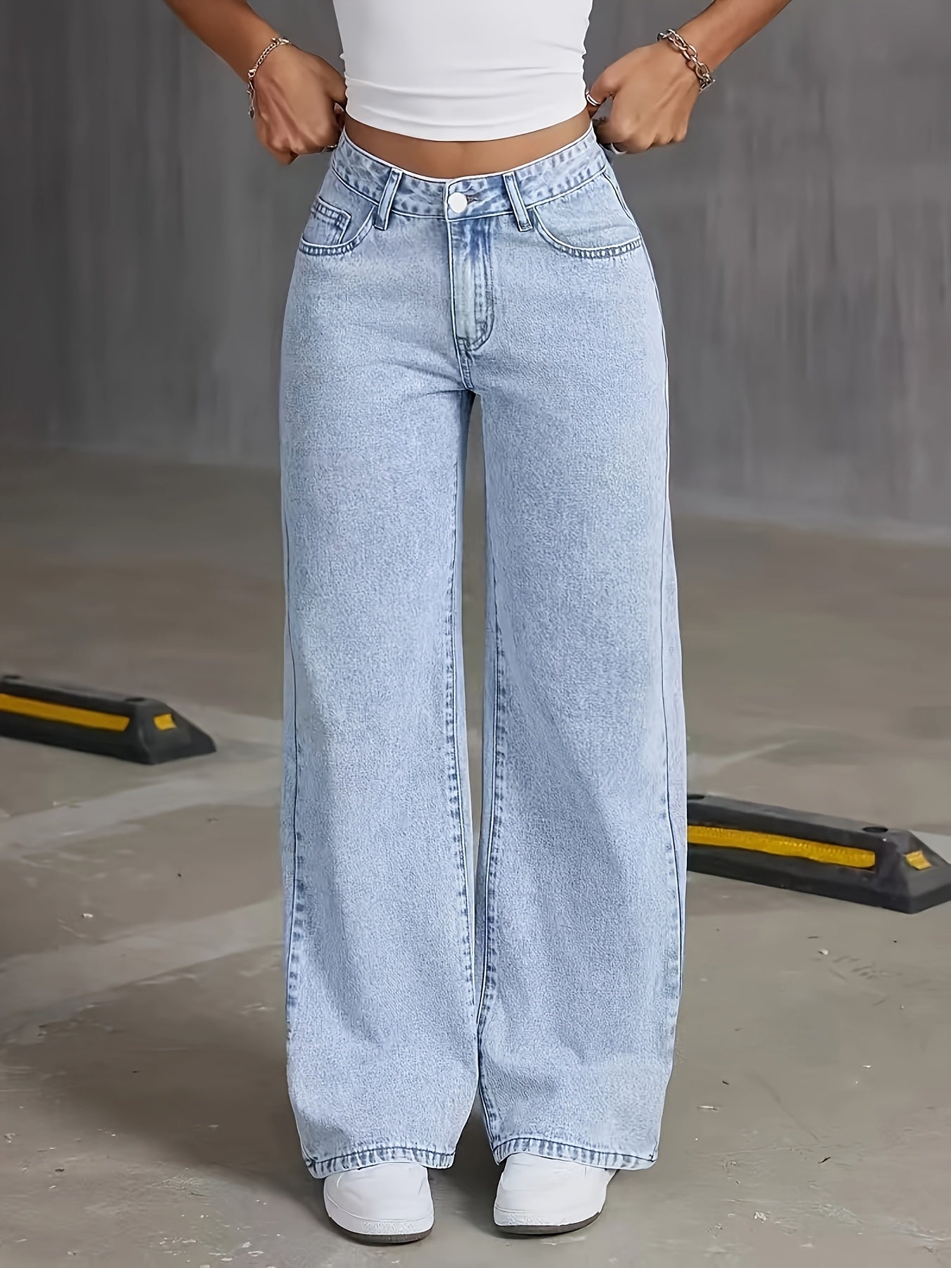 High-rise light wash blue denim wide-leg pants with butterfly details - street style, non-stretch fabric, machine washable.