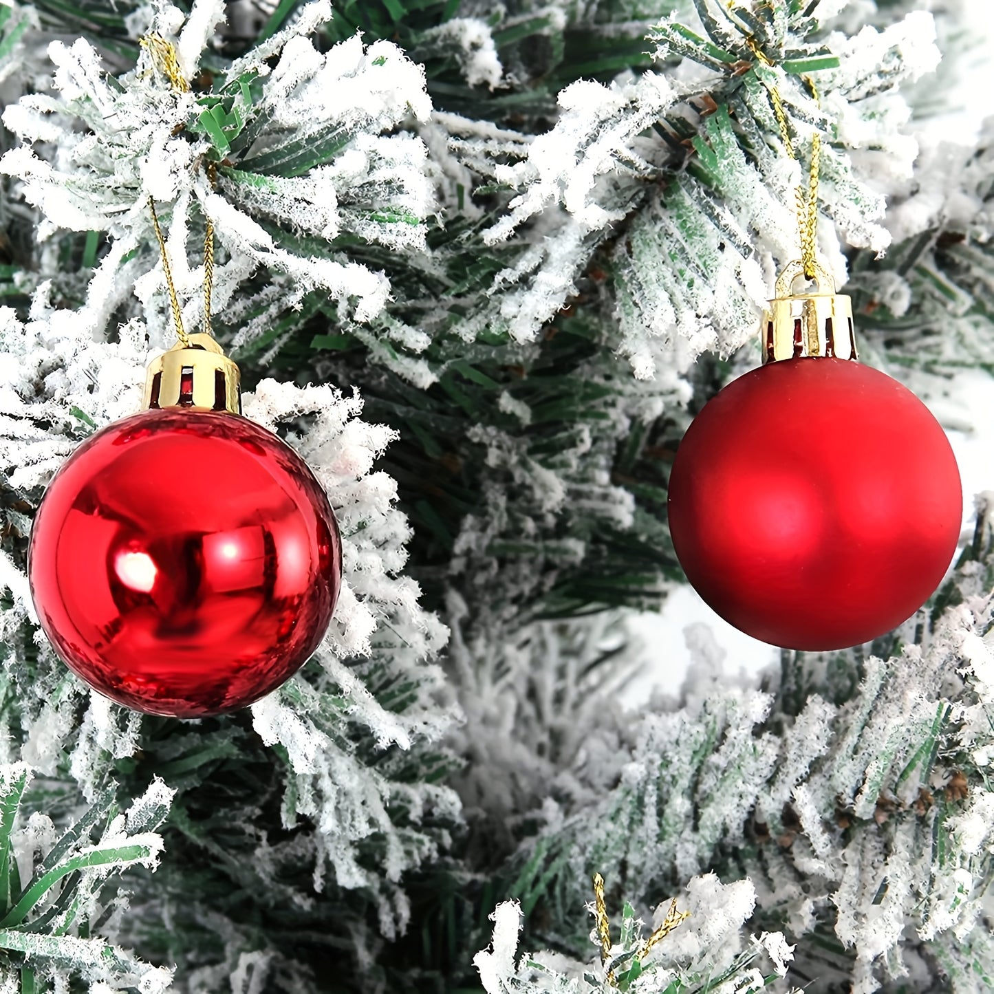 24 shatterproof Christmas tree ornaments in various sizes for festive decorations.