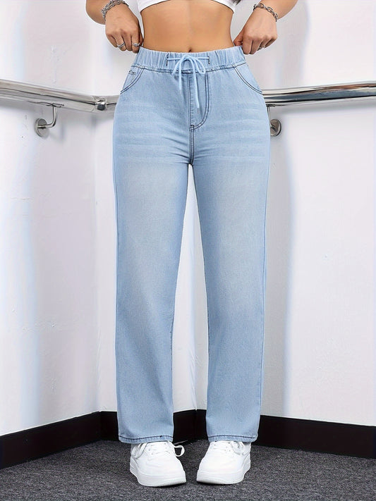 Women's stylish washed blue jeans with elastic waistband, made from comfortable polyester blend denim, suitable for all seasons.