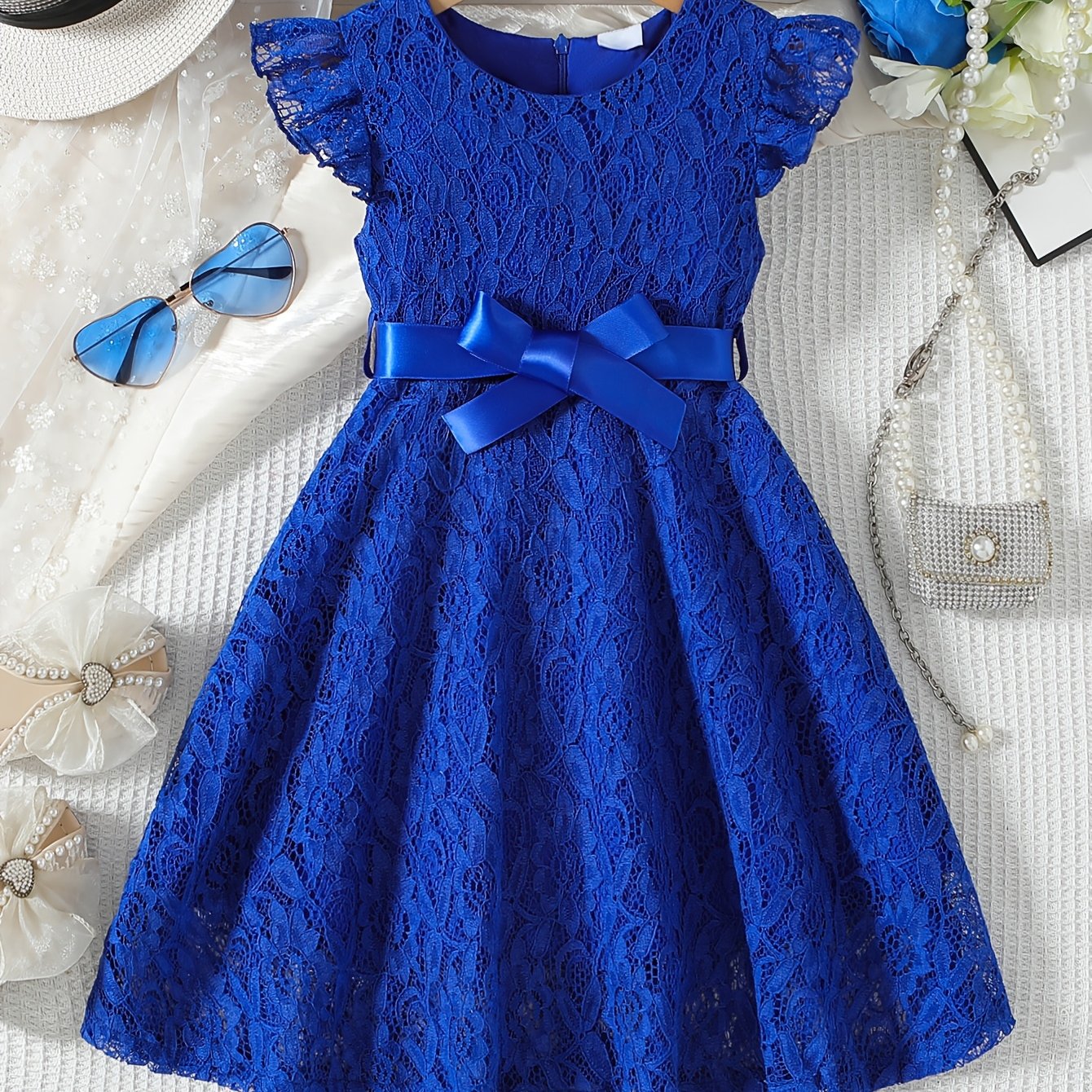 Girls' spring/summer dress with lace detail, belt, and flutter sleeves, ideal for daily wear or birthday parties.