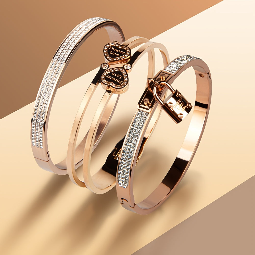 Stylish set of 3 stainless steel bracelets for women, plated in 18K gold with a heart-shaped pendant adorned with sparkling synthetic zirconia. The perfect luxury gift for weddings, parties, and Christmas, suitable for all seasons.