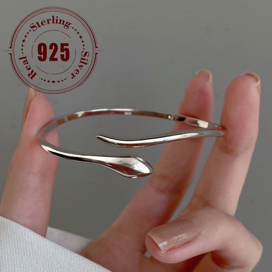 Chic and alluring animal-inspired sterling silver cuff bracelet, featuring a 925 snake-shaped bangle. With a minimalist design and no plating, this bracelet is perfect for everyday wear and special occasions. One piece weighing approximately 6 grams.