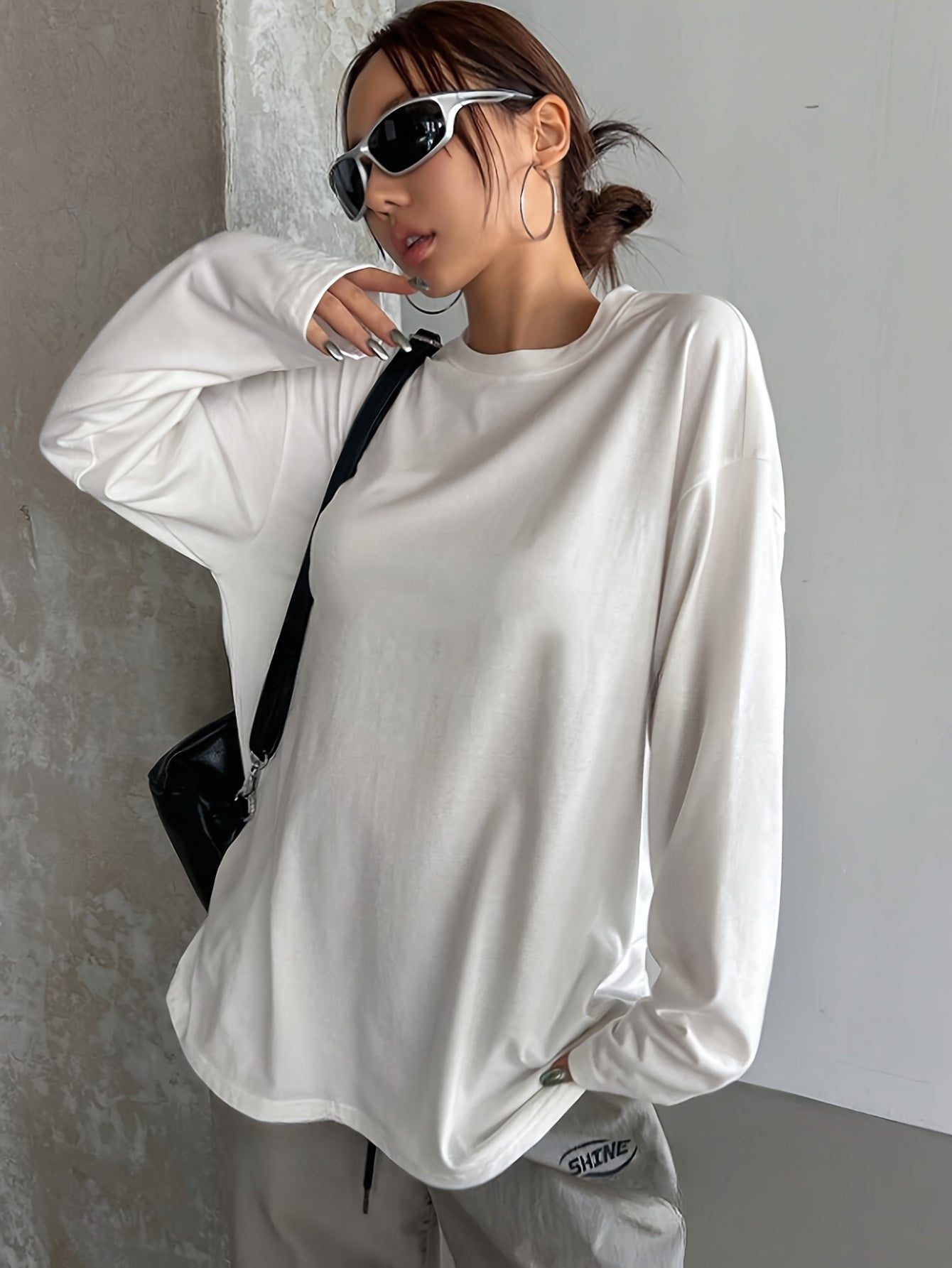 Women's casual crew neck long sleeve t-shirt in white, made of 62% polyester, 34% viscose, and 4% elastane. Regular fit with medium stretch, suitable for fall/winter fashion.