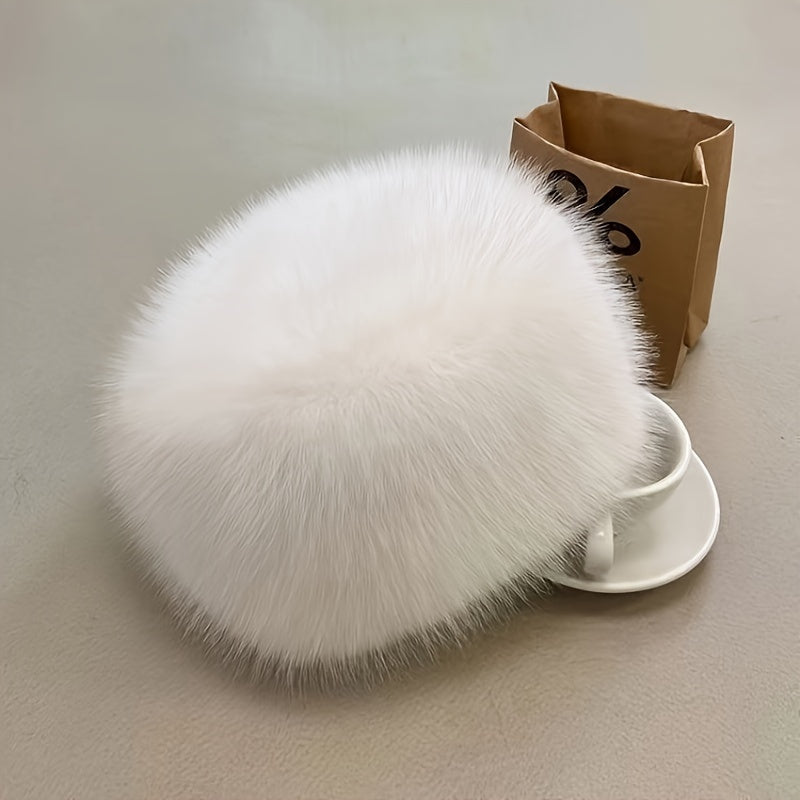 Faux fur bucket hat for women with flat top dome style, providing thick, warm ear protection. Chic snow spirit design, machine washable for winter outings.