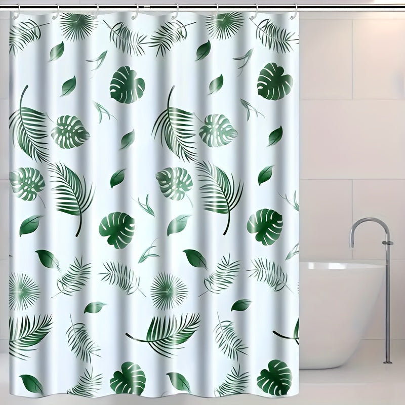 Tropical leaf bath liner made of water-resistant polyethylene, featuring a leaf pattern. Includes easy-hang white plastic hooks for all-season bathroom decor.