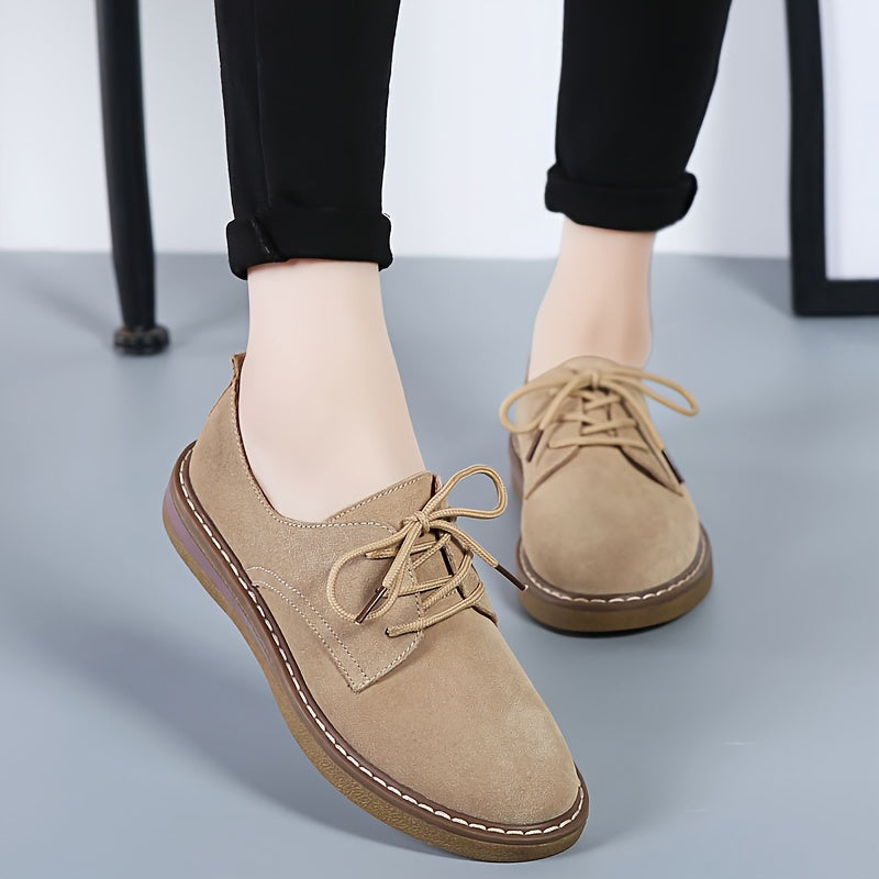 Women's flat, lace-up loafers in solid color, perfect for back to school with a comfortable preppy style.