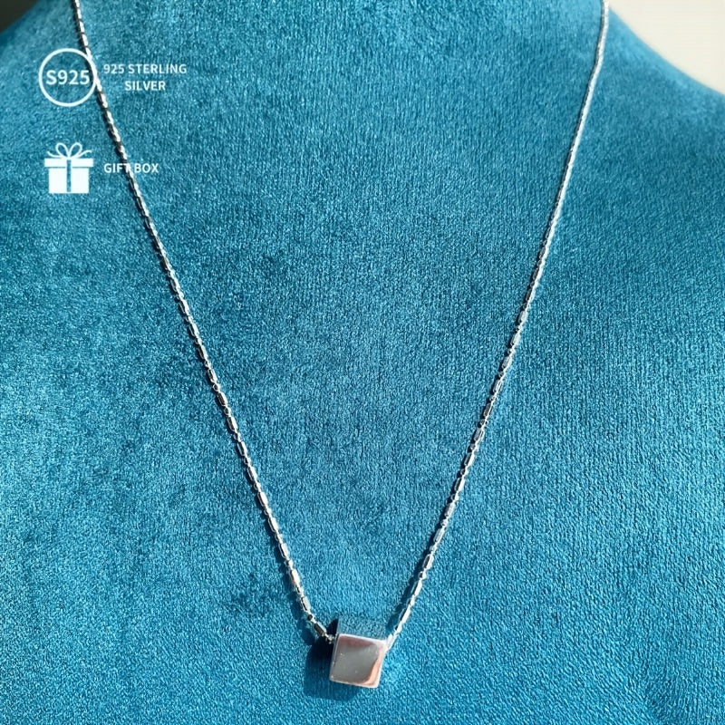 This stunning 925 Sterling Silver necklace features a small three-dimensional square pendant, weighing approximately 2.57G. It makes a thoughtful gift for Mother's Day, Thanksgiving, Halloween, Christmas, and New Year celebrations. Perfect for beer