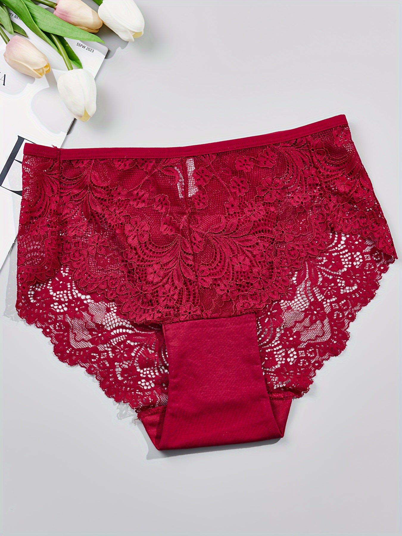 1 pair of women's lace-trimmed brief panties made from soft, breathable nylon blend for everyday wear, sleep, dates, and light sports. Cute and semi-transparent design.