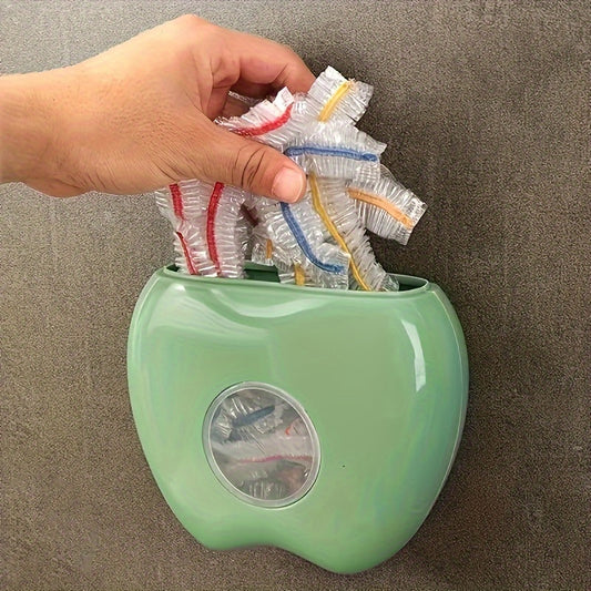 Wall-mounted bag holder shaped like an apple, perfect for storing disposable food covers and organizing kitchen and bathroom items safely.