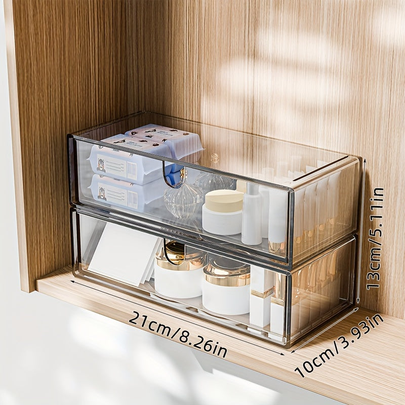 Cosmetics storage box with drawers, stackable design for bathroom and bedroom organization.