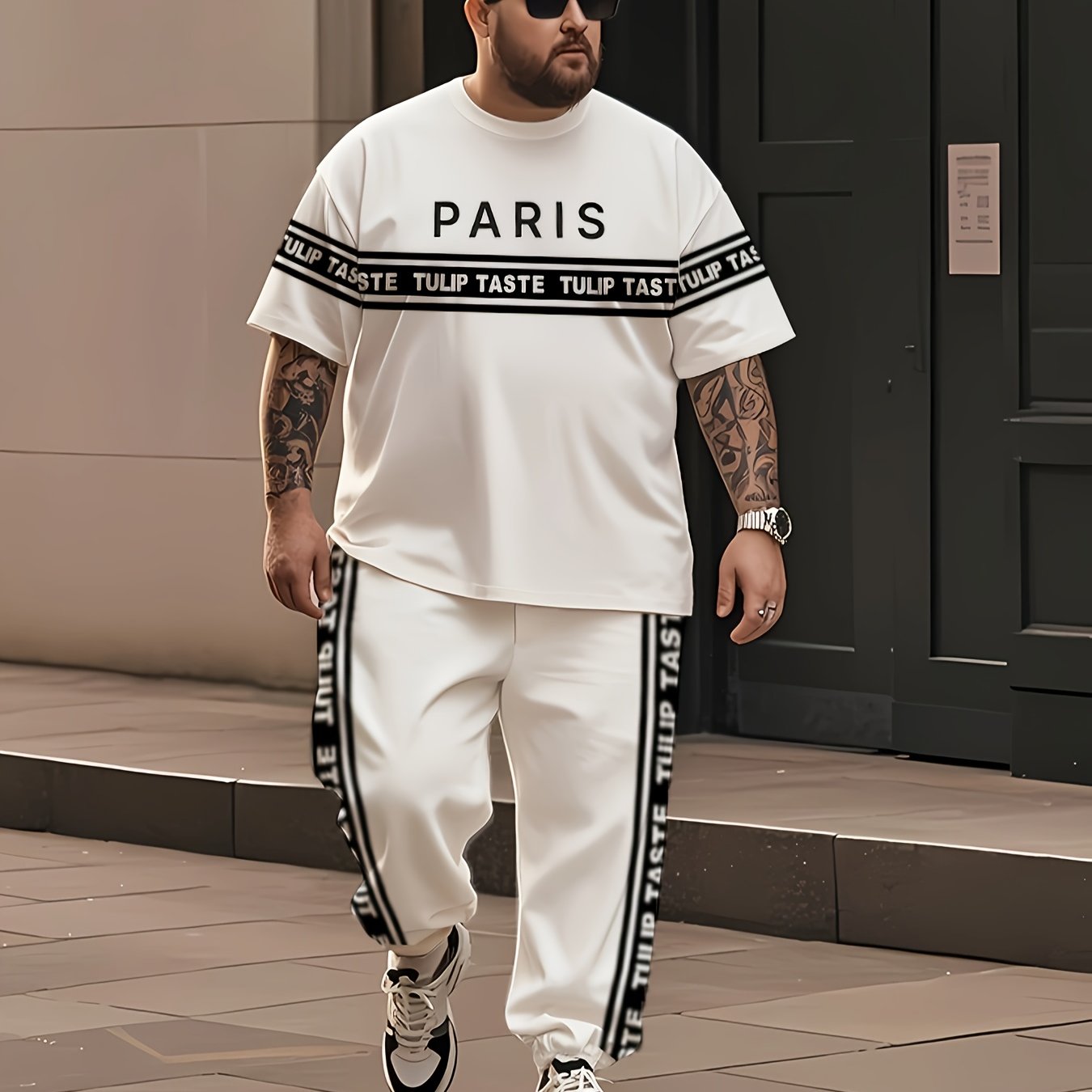 Plus size urban style black and white striped men's t-shirt and pants set featuring mixed print Paris letter street culture design, perfect for trendy summer streetwear.