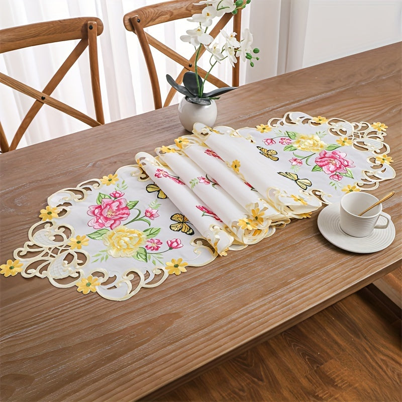 Elegant polyester table runner with hand-cut embroidered flowers and butterflies, perfect for home decor, restaurants, picnics, and parties. White base with vibrant floral patterns.