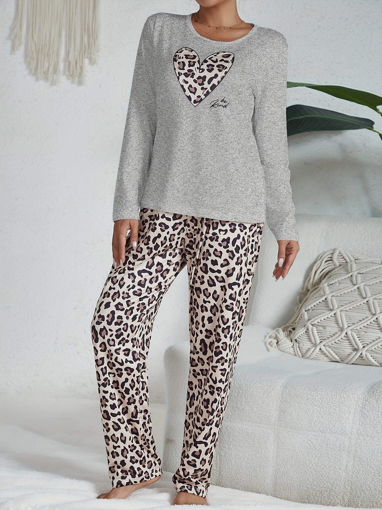 Casual leopard pajama set with long sleeve heart print top and pants for women's sleepwear and loungewear.