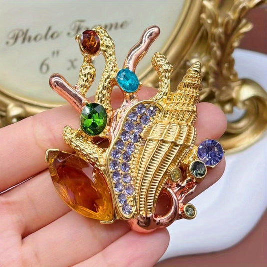 Elegant Conch Shell Brooch adorned with Colorful Rhinestones, Versatile Fashion Statement Piece, Vintage-inspired Marine Accessory, Unique Pin for Women.