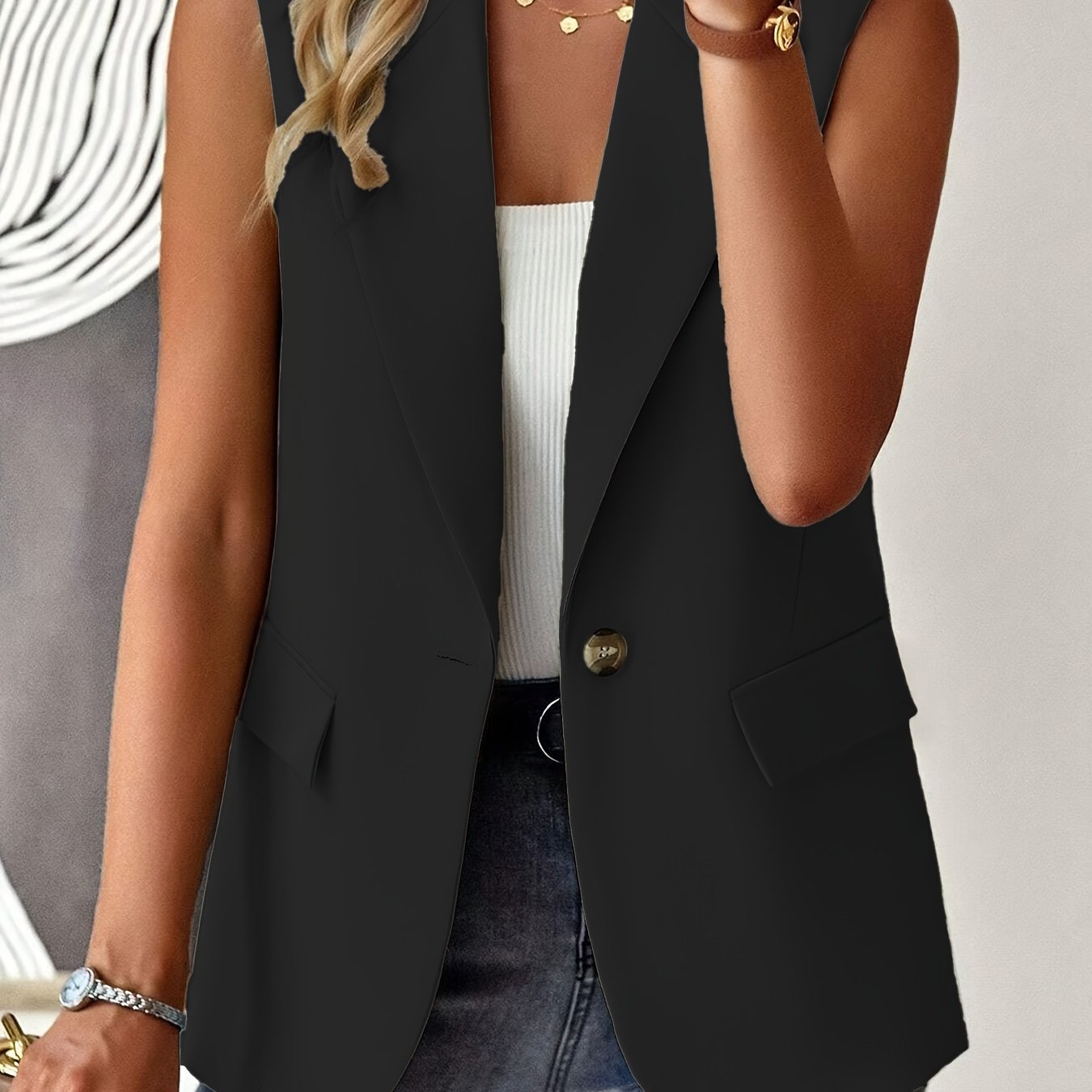 Sleeveless button front lapel vest in a solid color, suitable for spring and fall. Ideal for women's clothing.