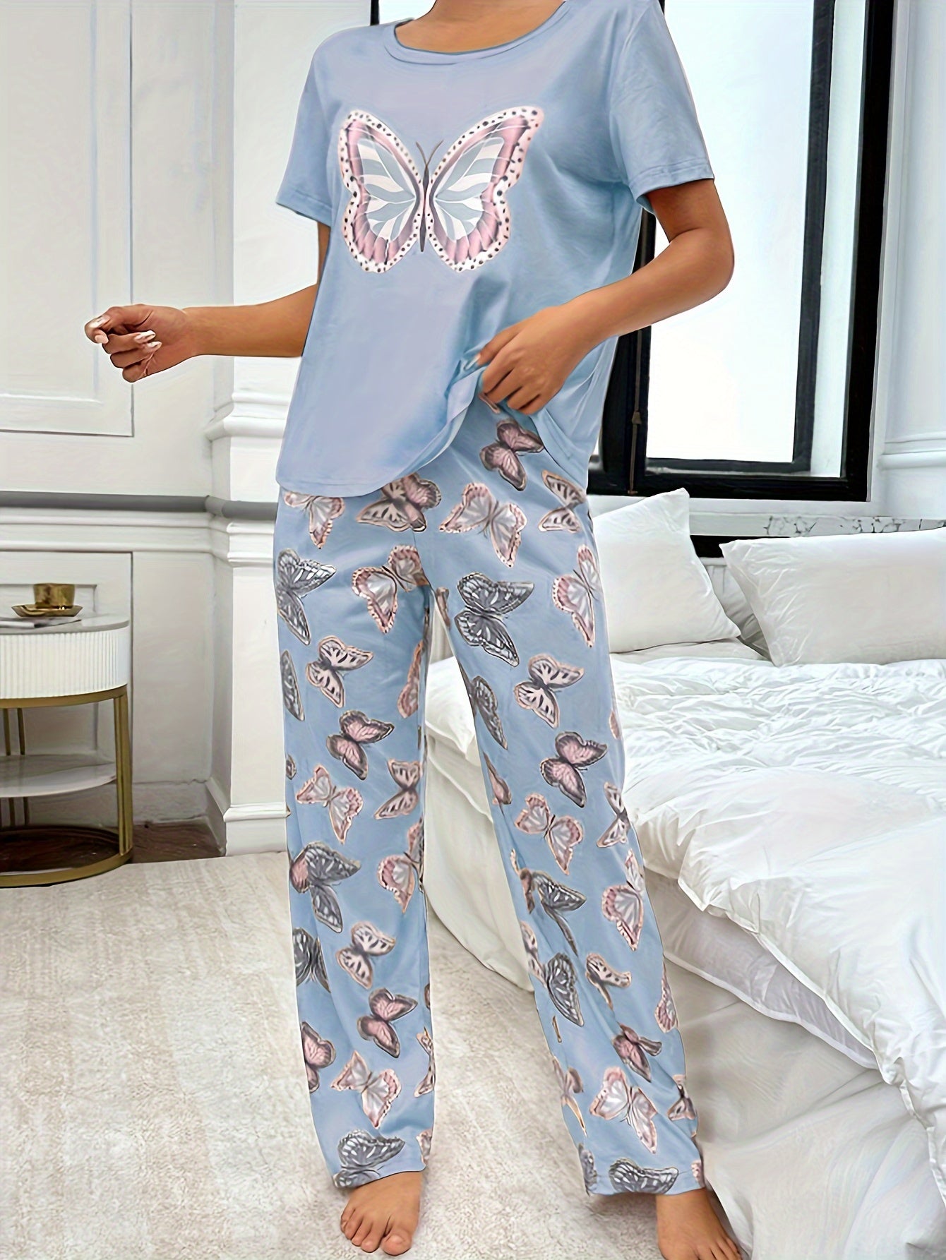 Butterfly print pajama set for women with round neck and short sleeve top, elastic pants.