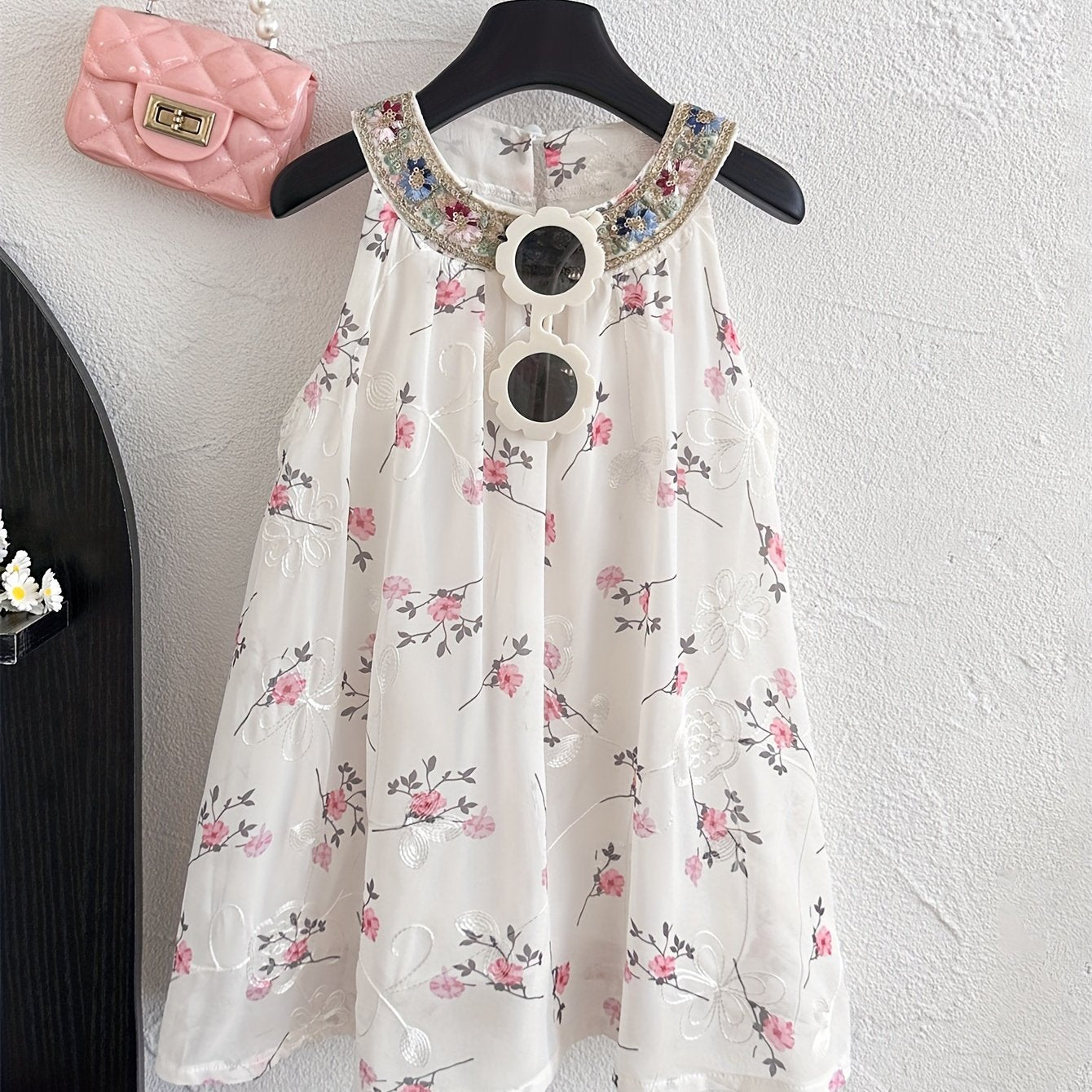 Summer floral sleeveless dress for girls, perfect for parties and everyday wear.