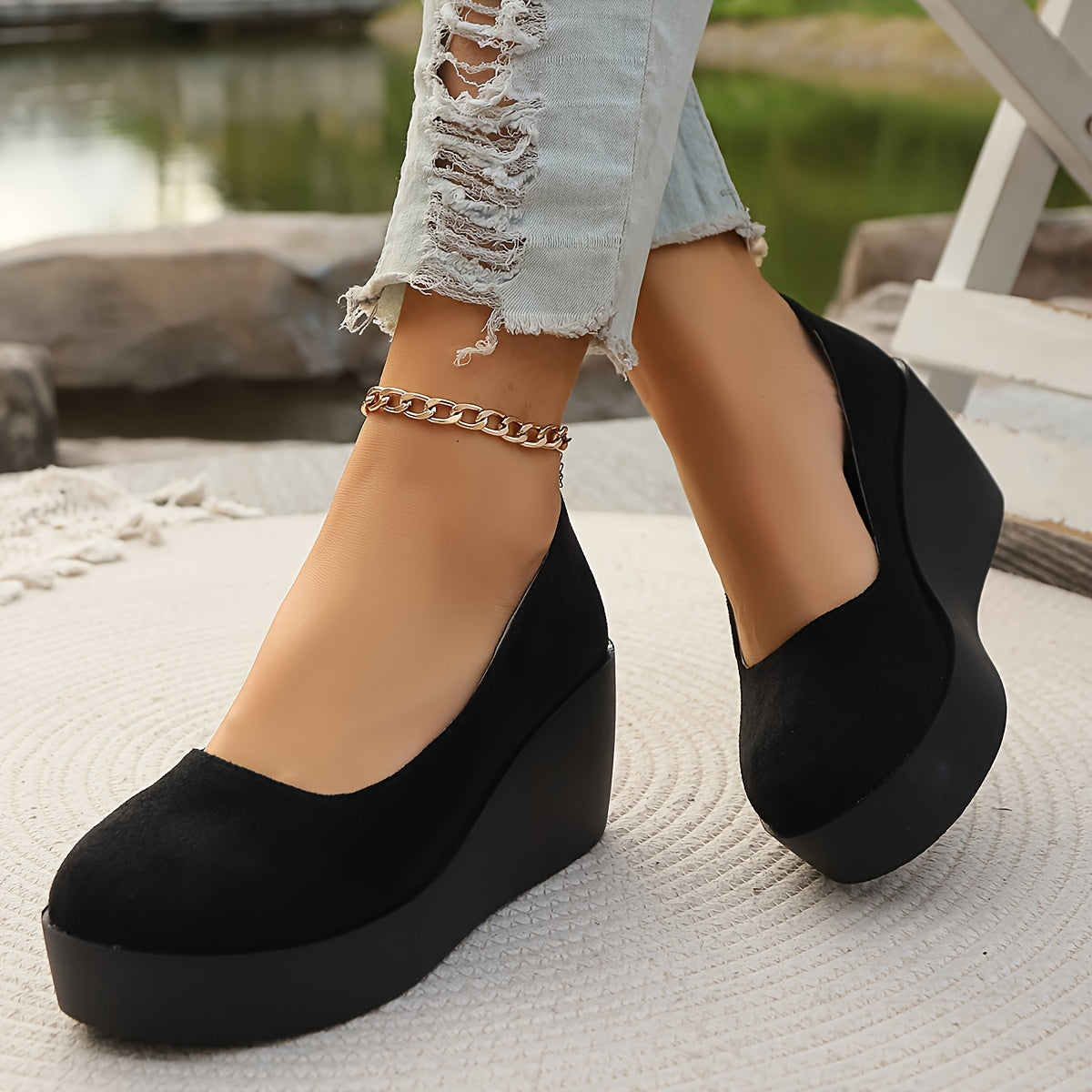 Women's stylish black slip-on platform wedge loafers for casual daily wear.