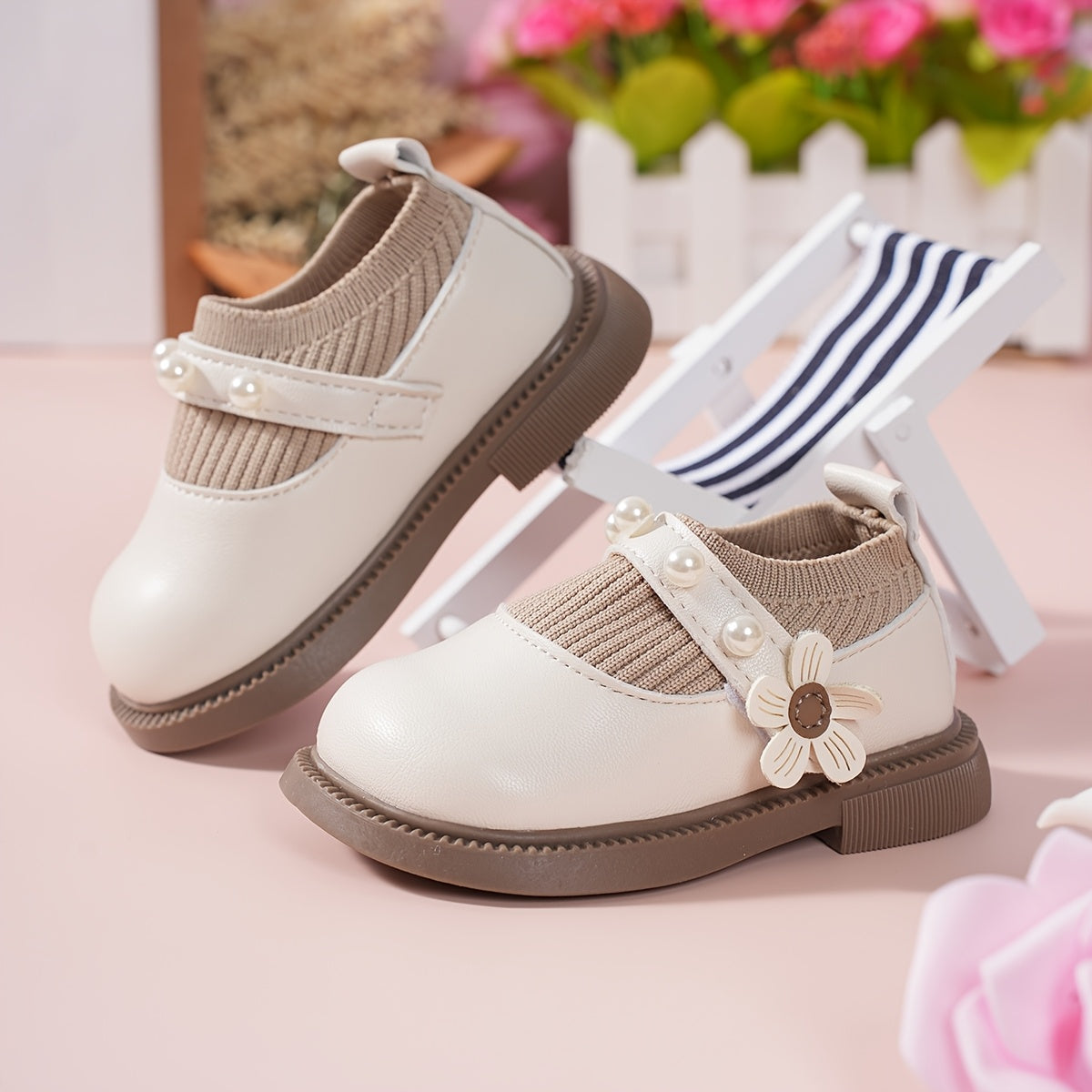 Pair of stylish baby shoes with flower bead accents, perfect for all seasons, including princess flats.