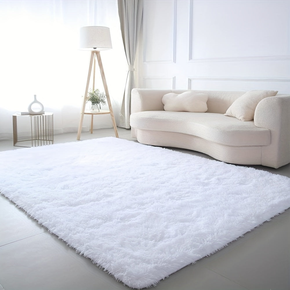 Soft and luxurious pure white plush area rug, ideal for bedroom, living room, and dorm décor. Made from machine washable polyester for easy care.