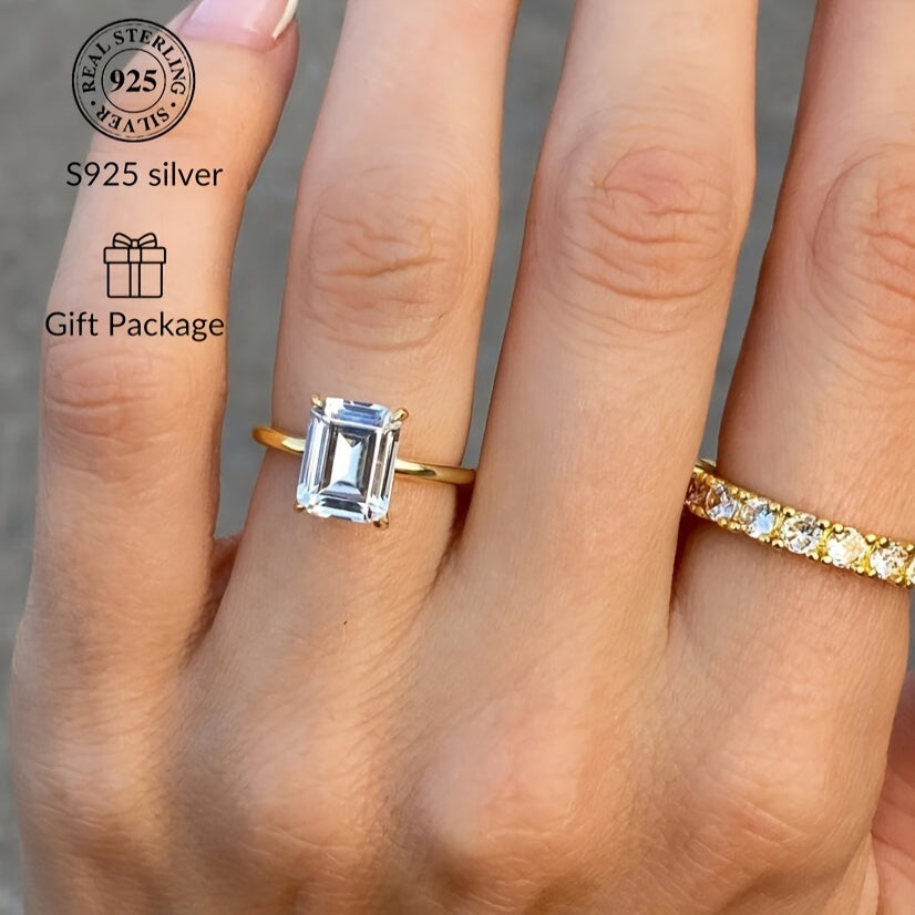 This stunning 925 Sterling Silver ring features a rectangular Cubic Zirconia stone, exuding elegance and luxury. It is perfect for both casual wear and gifting, with its simple yet sophisticated golden design. The simulated diamond comes in sizes of 1CT