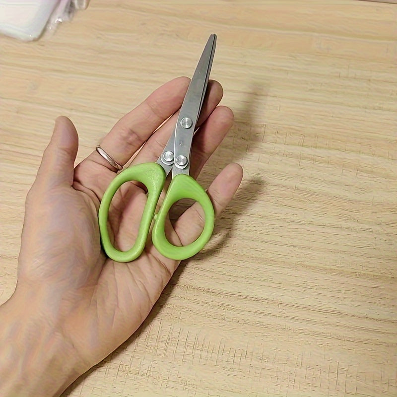 Multi-layer kitchen shears made of stainless steel for cutting herbs and green onions. These ergonomic metal shredder scissors come with a safety cover and easy-clean design.