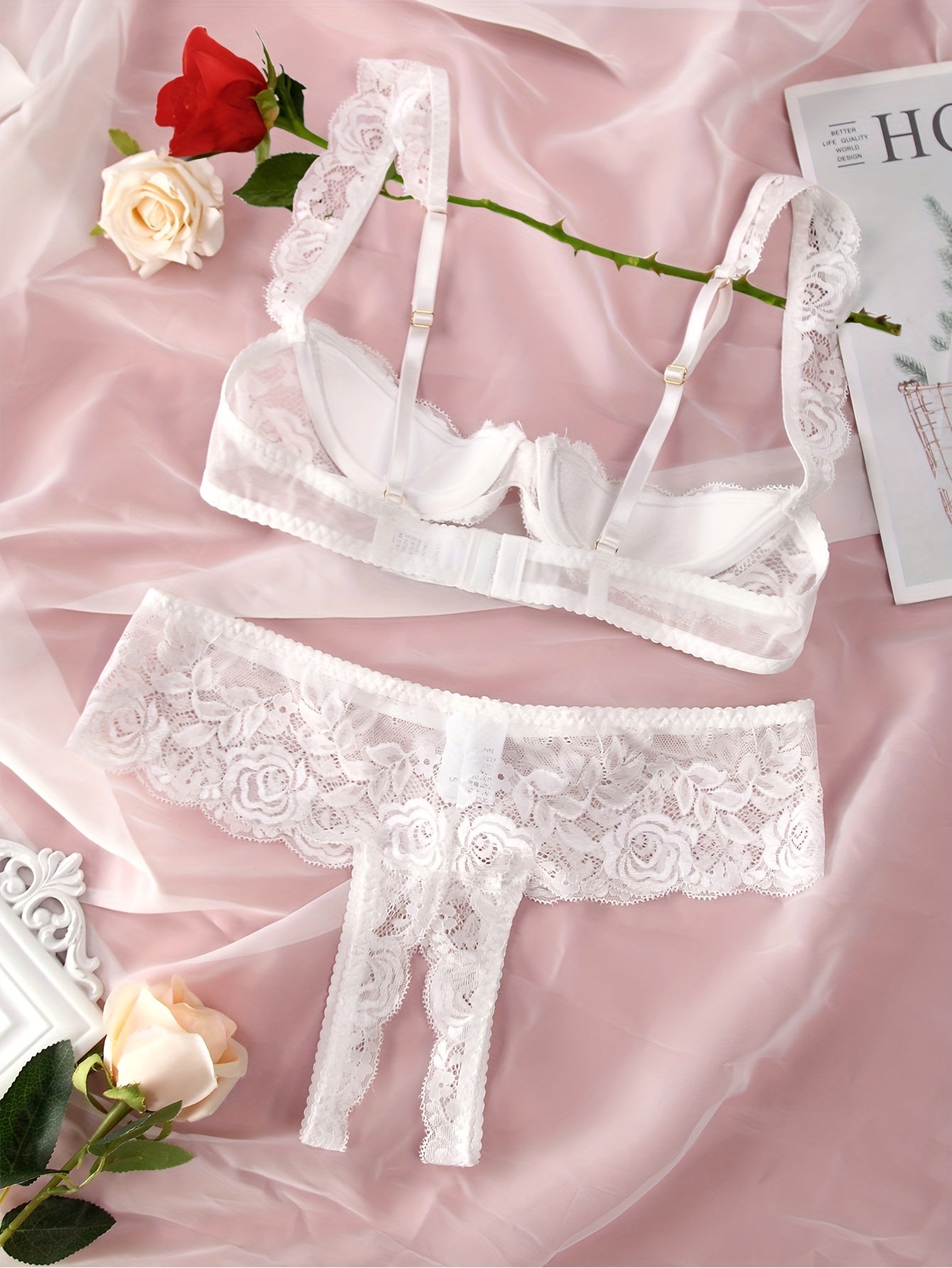 Floral lace lingerie set with open bust bra and crotchless panties for women.