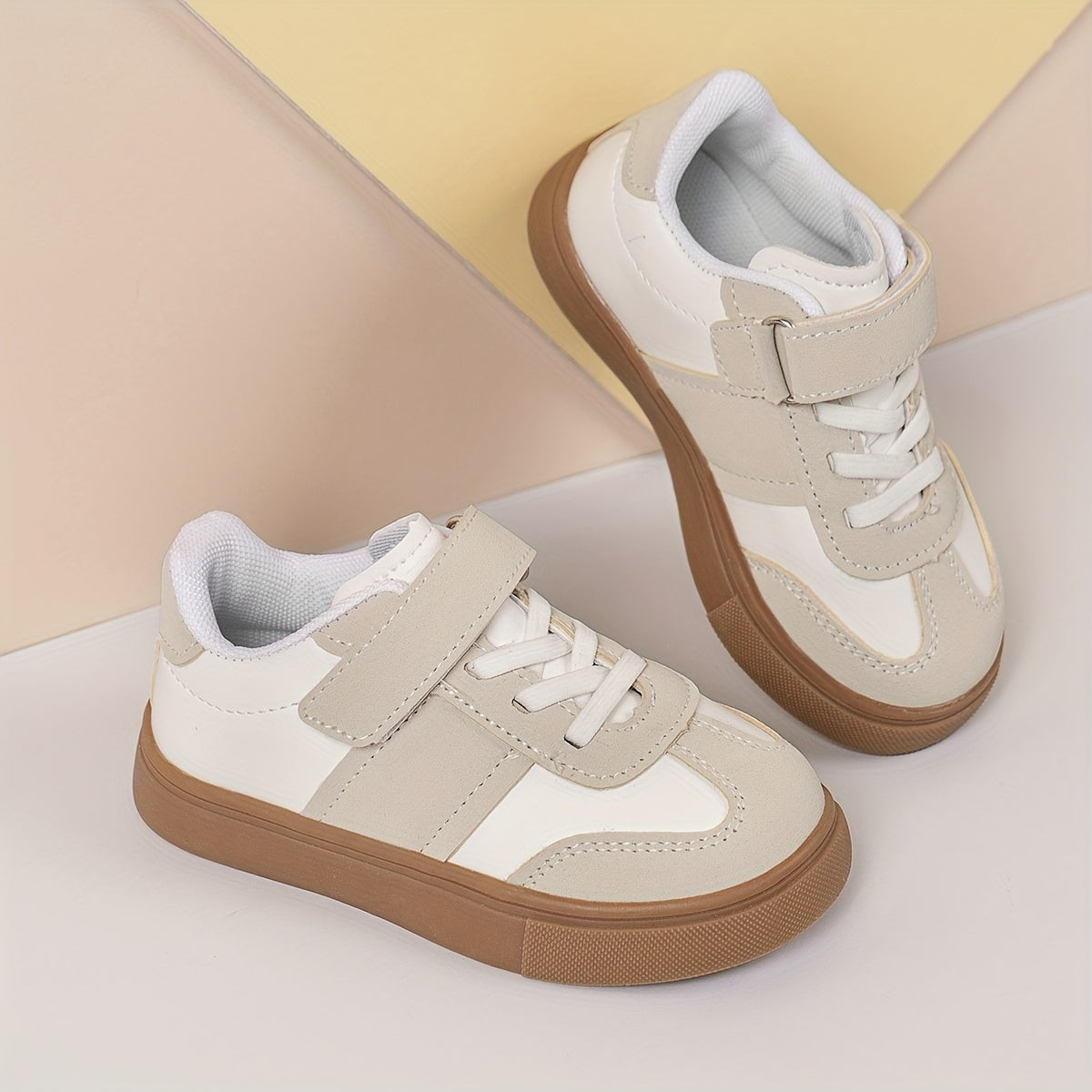 Youth sneakers with hook & loop fastener and non-slip sole, solid color design for boys and girls.