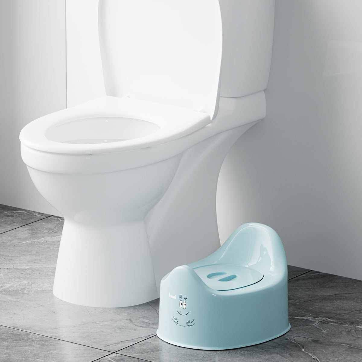 Heart-shaped potty training seat designed for children aged 0-3 years, featuring easy-clean durable PP material. Available in white, pink, or blue colors with a urine bucket for toilet training and promoting independence.