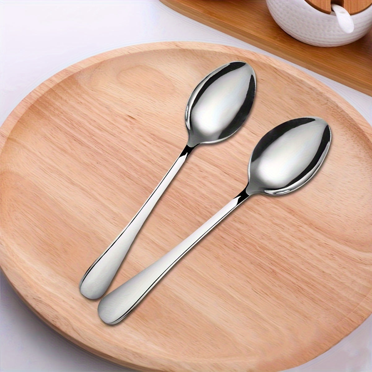 12-piece stainless steel dessert spoon set, 13.69cm, sleek design with black accents and polished finish. Perfect for home, kitchen, restaurants, and afternoon tea. Ideal for ice cream, coffee, and tea.