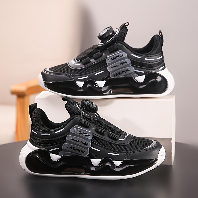 Black & White checkered athletic sneakers for boys with rotating buckle closure. Low-top design, lightweight and comfortable for school or sports.