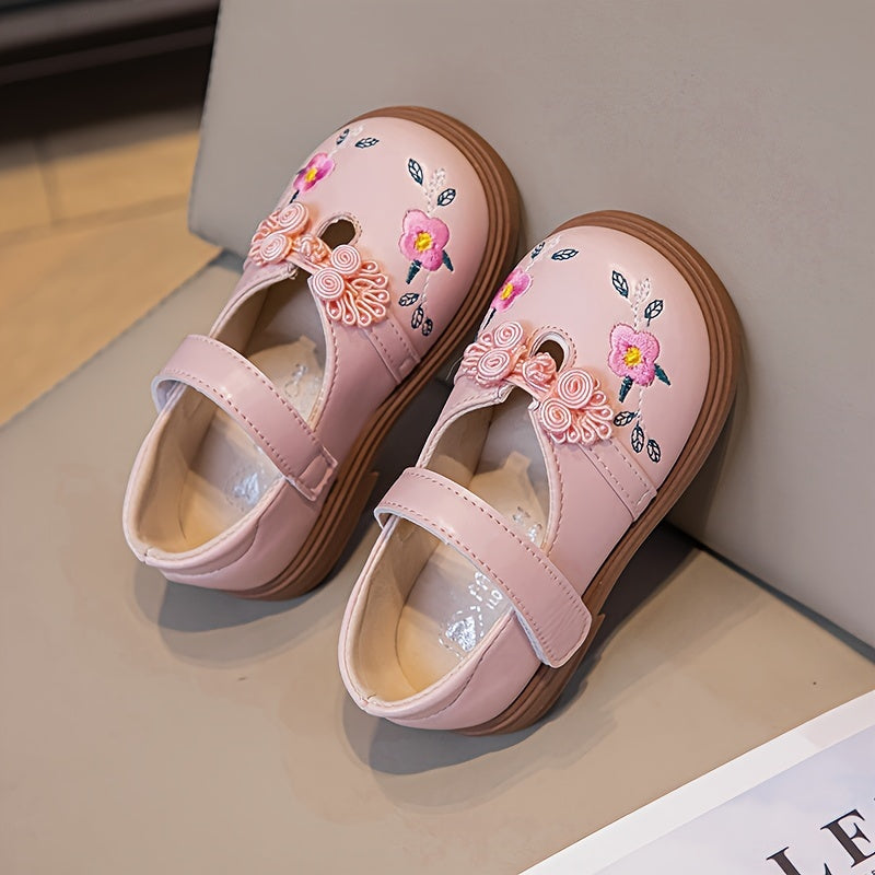 Girls' Mary Jane shoes with floral accents, soft non-slip sole for babies and toddlers.