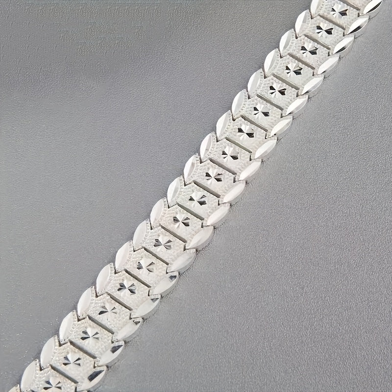 A hypoallergenic 925 sterling silver bracelet with a wide coin design, perfect for everyday wear and special occasions. Ideal for Mother's Day gift.