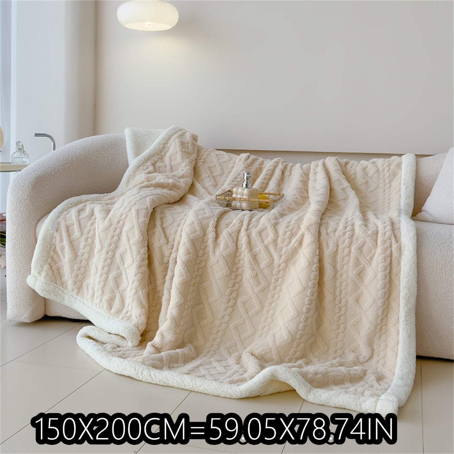 Soft cable-knit fleece blanket in blue, available in 150x200cm or 200x230cm sizes. Featuring a contemporary style, this blanket is machine washable and perfect for use in the bedroom, living room, office, or while camping during the winter. Made with a