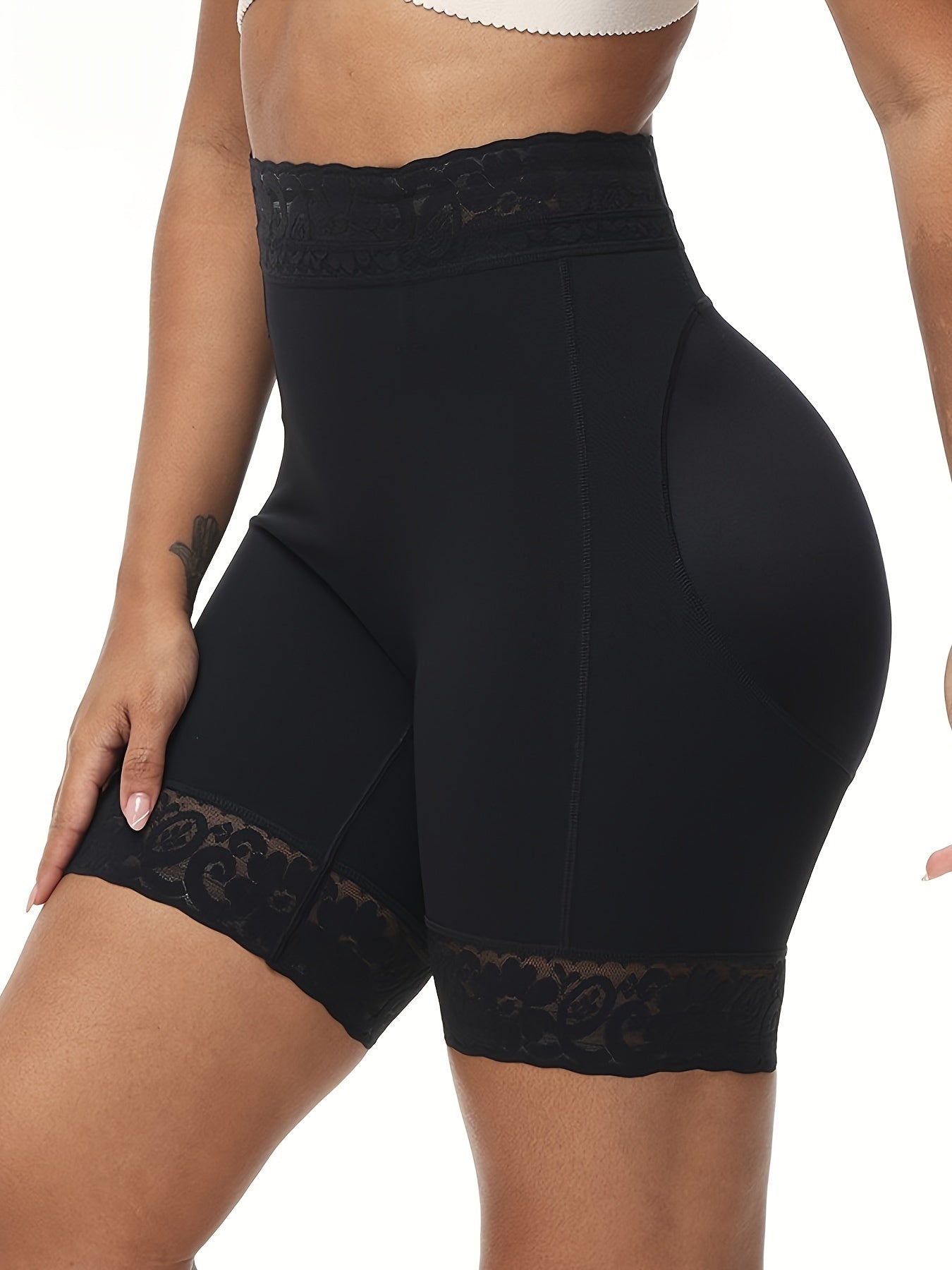 Women's high-waist shaping shorts with lace trim, tummy control, and butt lifting. Made from a breathable nylon/elastane blend with a seamless body sculpting design and floral lace detail.