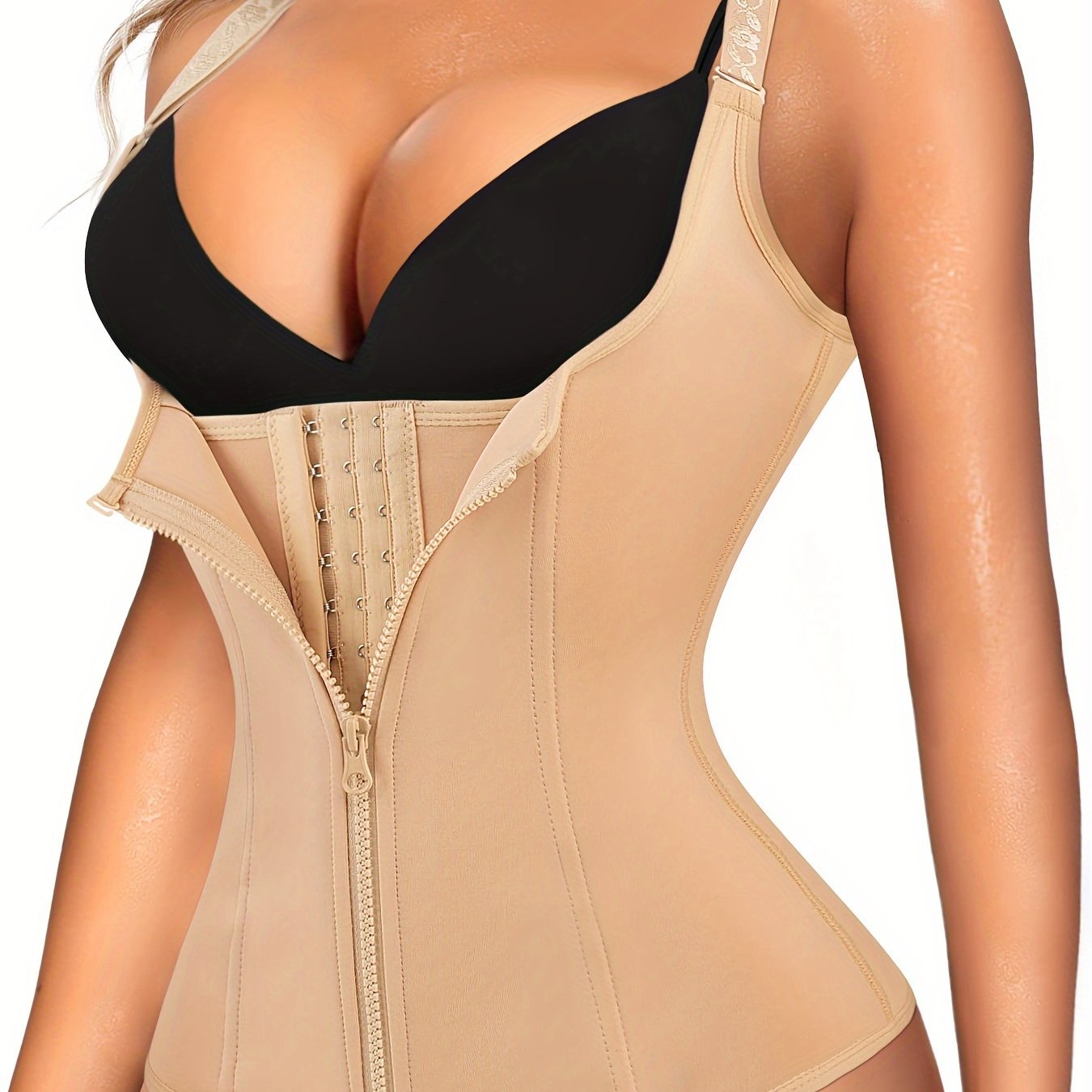 Enhance your curves and define your waistline with Junlan Women's Black Zipper Shaping Cami Top. This waist trainer features tummy control and open bust design for a slimming effect. Made