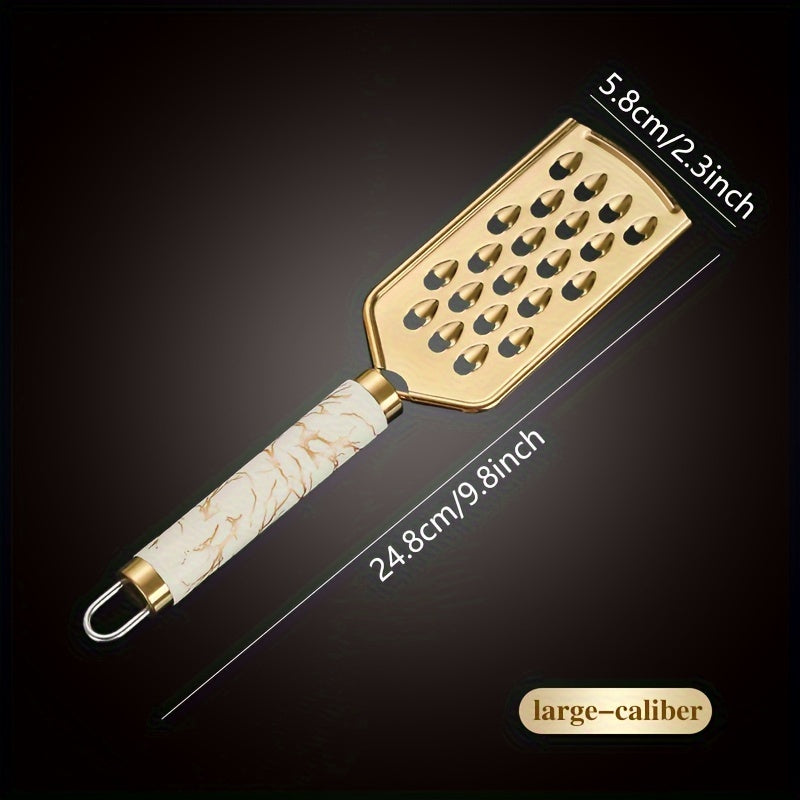 Stainless steel kitchen grater for shredding various foods, with a safe handle and luxurious golden appearance.