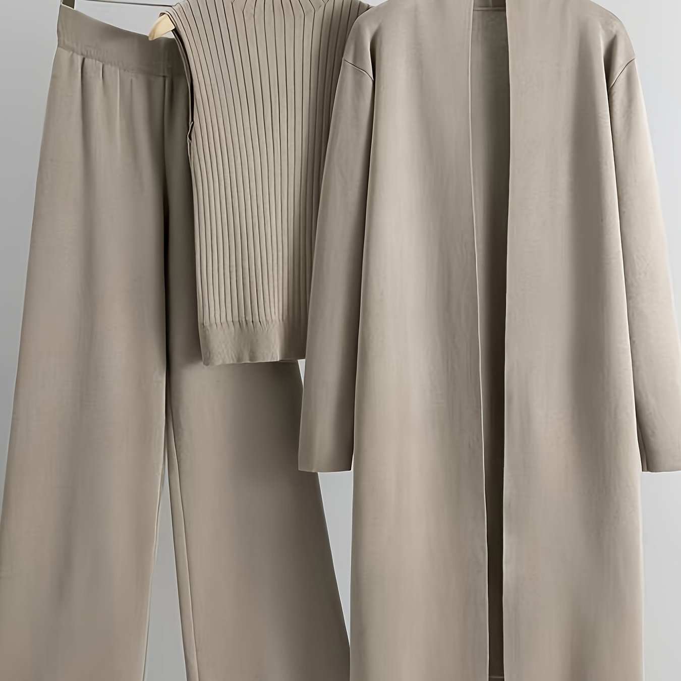 2024 women's three-piece knit set with wide-leg pants, cardigan, and turtleneck sweater.