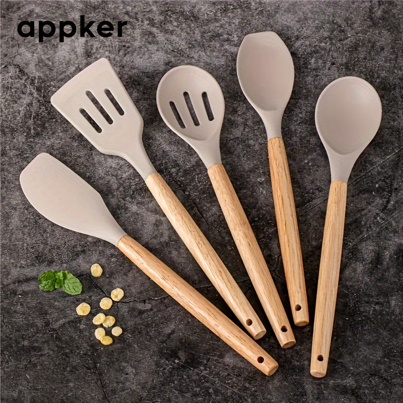 Appker's 5-piece Silicone Kitchen Utensil Set features Non-Stick, Safe Cooking Tools with Wooden Handles. Washable and Modern, this set is Perfect for Home Chefs.