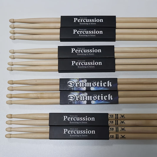 High-quality maple drumsticks in 5A, 7A, & 5B models. Unfinished natural wood for authentic sound, perfect for drummers.