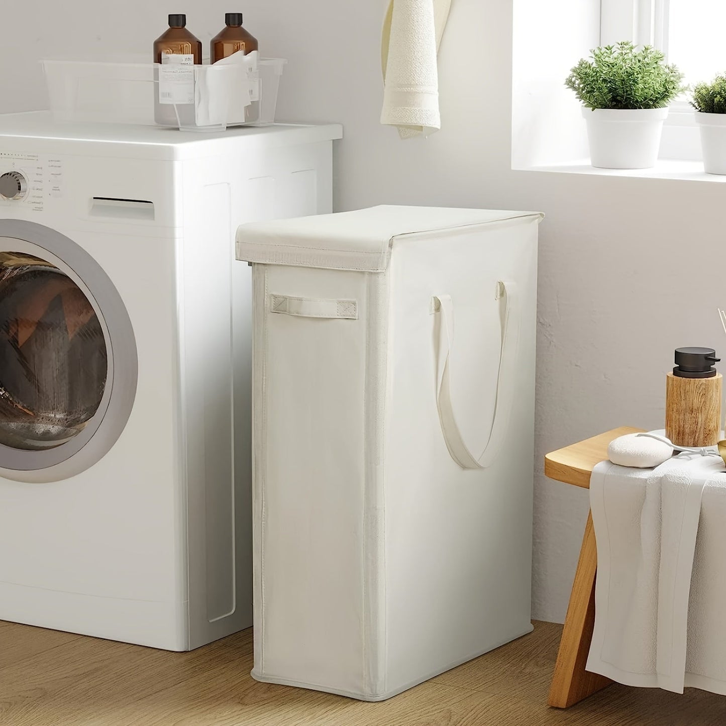 The ultra-slim 60L laundry hamper with a lid is conveniently foldable and portable, making it an ideal storage solution for dirty clothes. This basket includes handles for easy transportation and is perfect for use in the bedroom, bathroom, dorm, or