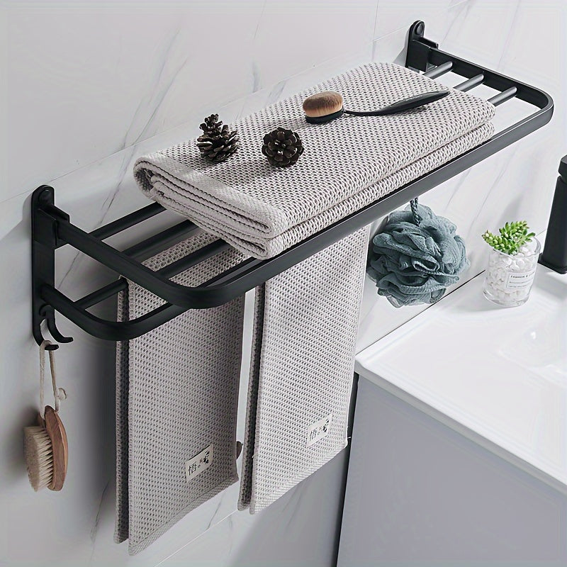 Compact black wall-mounted bathroom shelf with towel bar and hooks for convenient storage of towels, toiletries, and accessories. Easy to install with a sleek modern design and sturdy metal construction. Perfect towel holder for any bathroom.