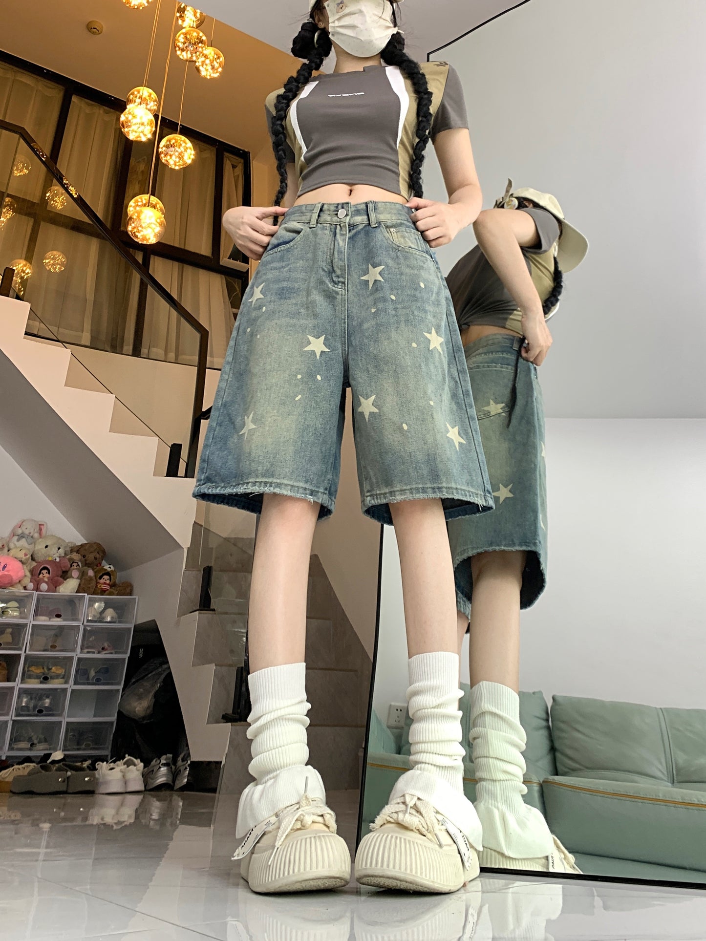 Women's casual denim shorts with star pattern, button fly, loose fit, slight stretch, and washed jeans for summer street style. Made of 70% cotton and 30% polyester.