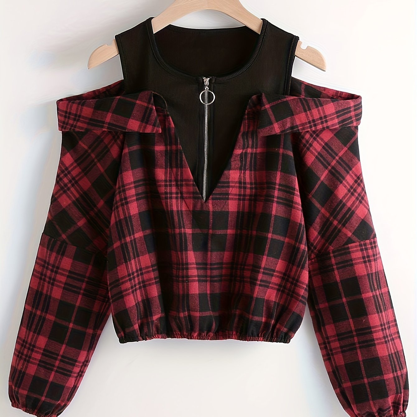 Cold shoulder plaid print blouse with long sleeves and quarter zip, suitable for spring and fall.