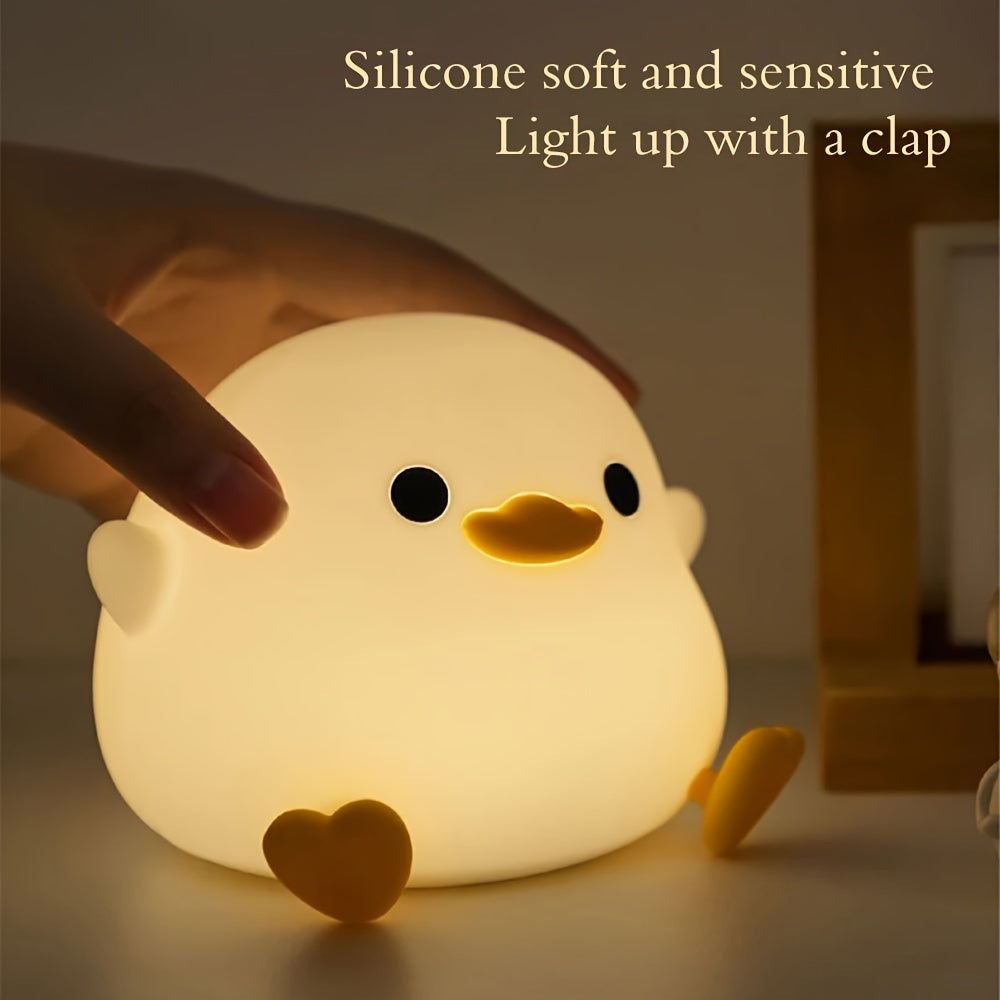 Cute duck-shaped touch control night light with RGB color changing, soft silicone bedside lamp, USB-C rechargeable desk light, perfect gift for any room.