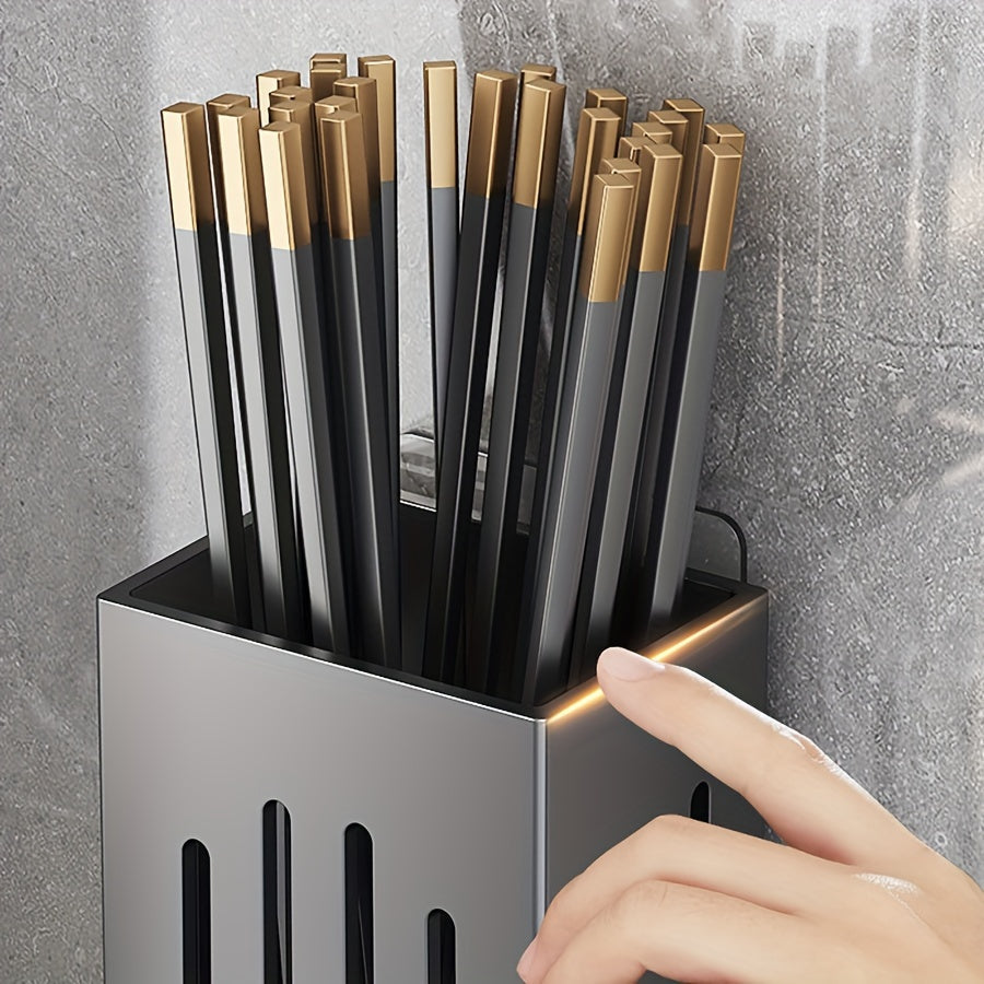 Organize your kitchen with this convenient wall-mounted storage rack! Made of durable plastic, this utensil holder features a chopstick cage with a drain tray, perfect for storing cutlery, knives, forks, spoons, sponge brushes, and more. No electricity