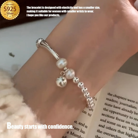 This Elegant Silvery Bracelet features embedded pearls, exuding luxury and sophistication. With a high-end and unique design, it is cool, refreshing, and perfect for those seeking individuality. This exquisite piece is a great gift, guaranteed to bring