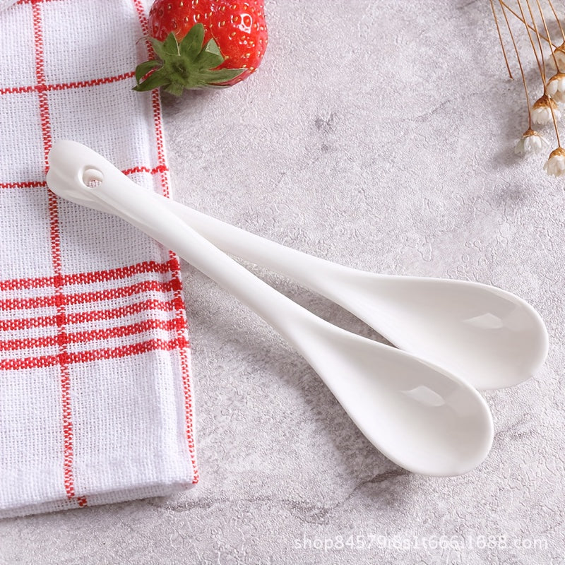 A set of 10 ceramic spoons with a long handle measuring 12.95cm, made of white porcelain for serving coffee, soup, seasoning, and espresso. Perfect for adding an elegant touch to your kitchen and dining essentials.