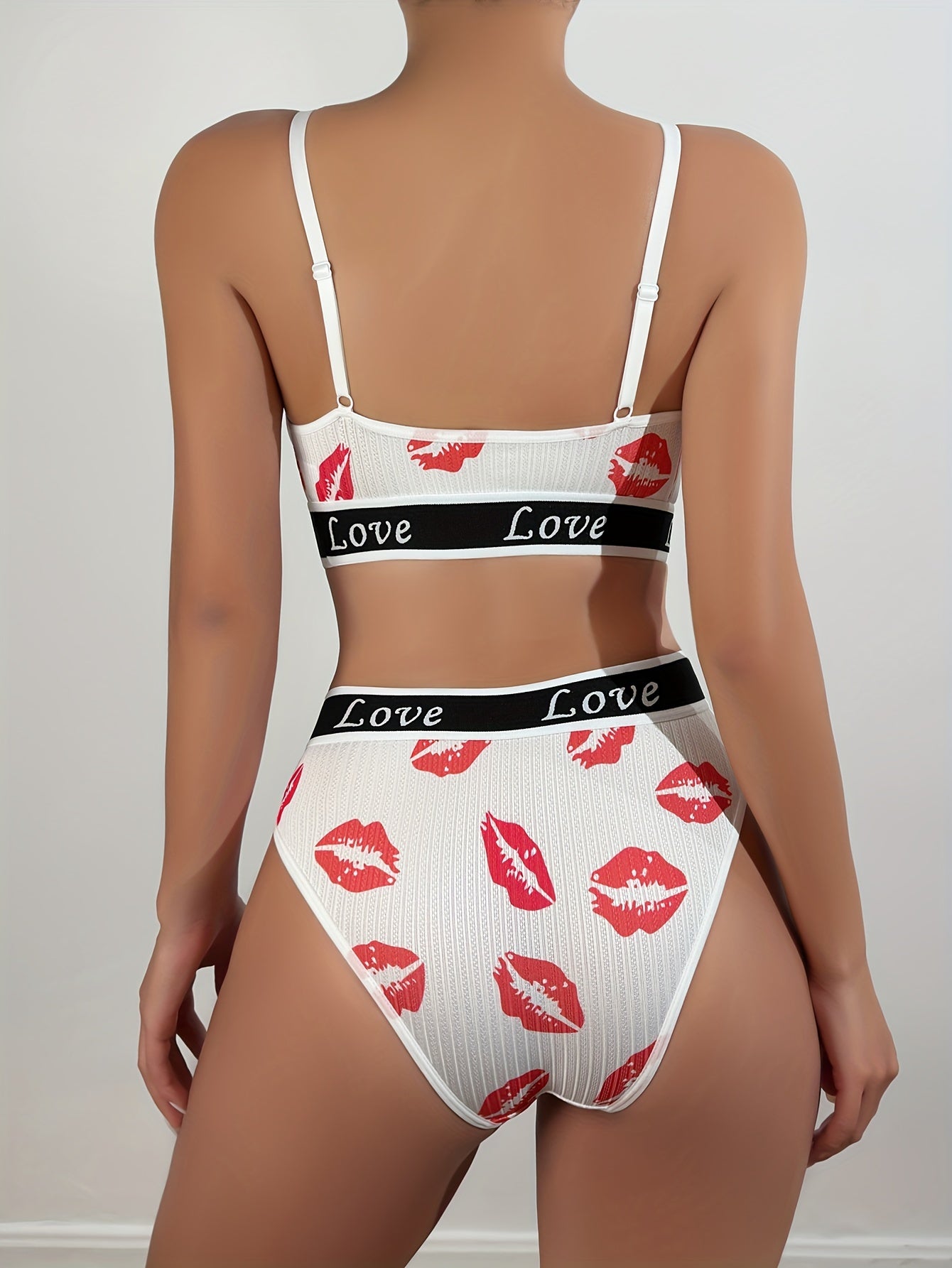 Women's cute cartoon lingerie set made from 90% polyester and 10% elastane. Includes letter and lip print bikini and triangle panties. Skin-friendly and comfortable knit fabric.